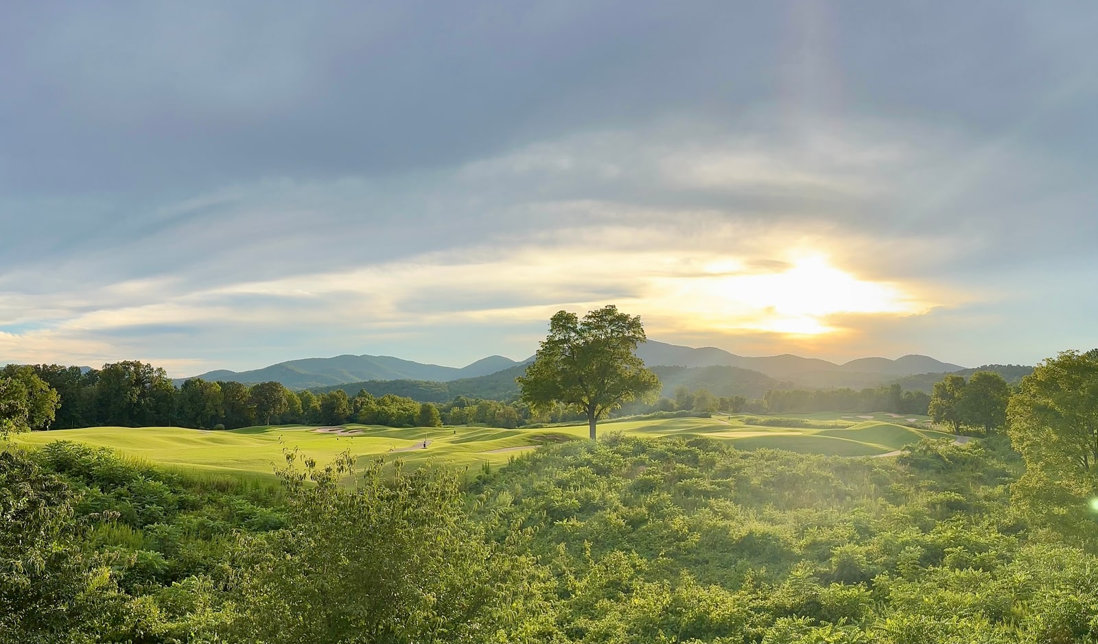 Mountain golf course glowing in warm evening light