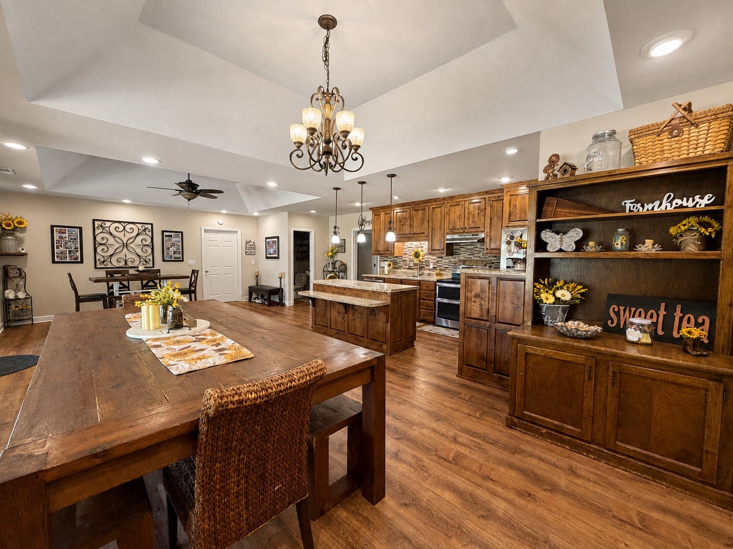 Kitchen and dining area with extensive wood cabinetry and built-in hutch