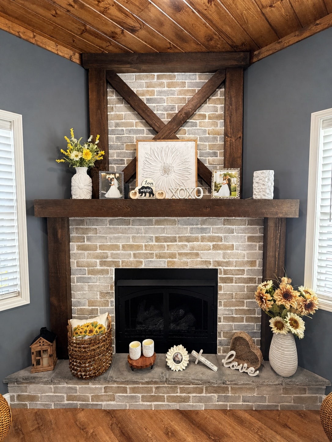 Close view of the living room's brick fireplace and timber mantel