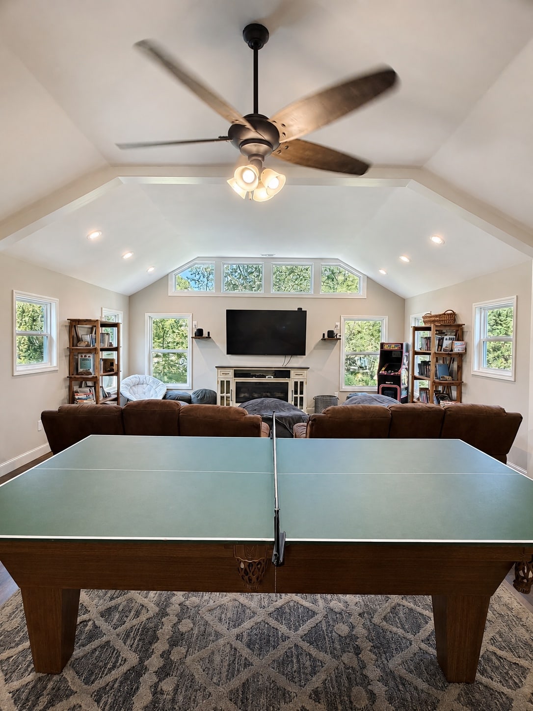 Recreation room with table tennis and a vaulted media lounge