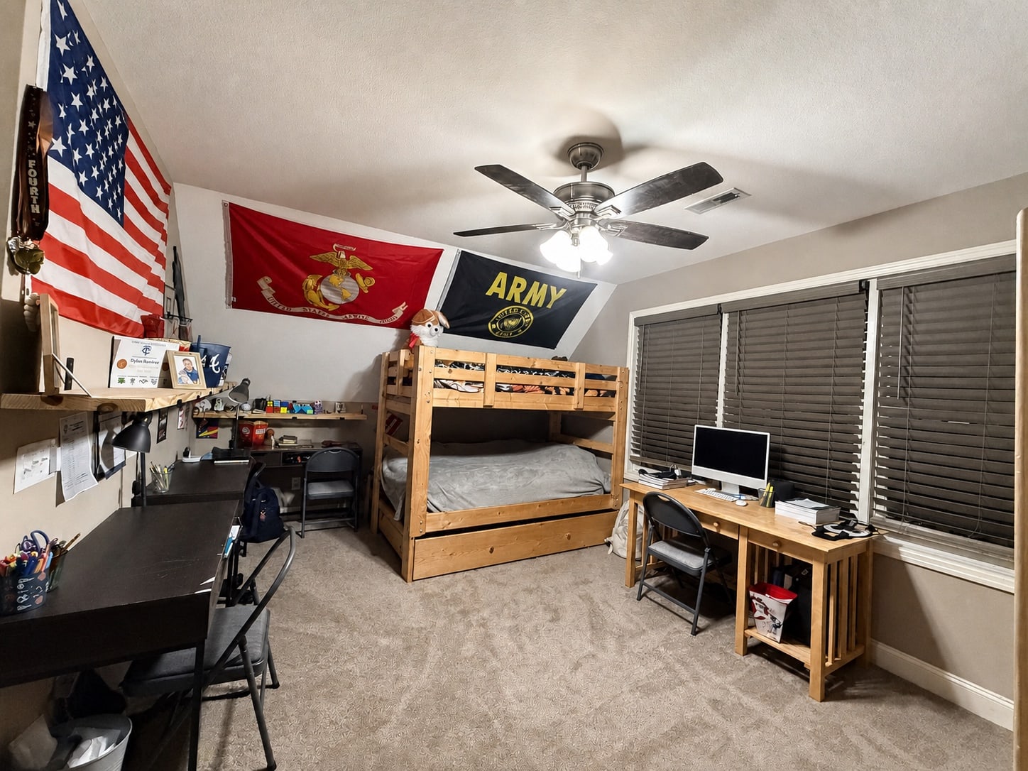 Alternate view of the bunk room with desks and wide windows