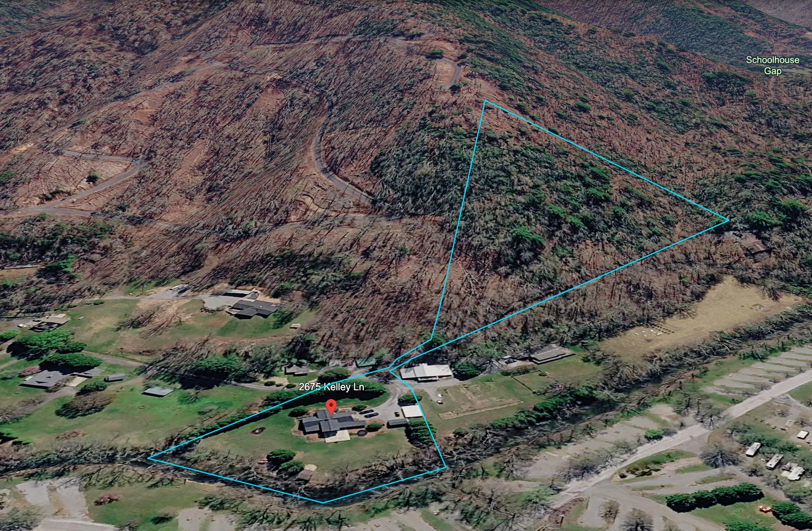 Oblique aerial view with the riverfront homesite and connected mountain parcel outlined in blue